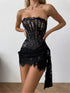 Black lace corset dress worn by a model on a plain background