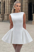 Woman wearing a white dress in front of classical architecture